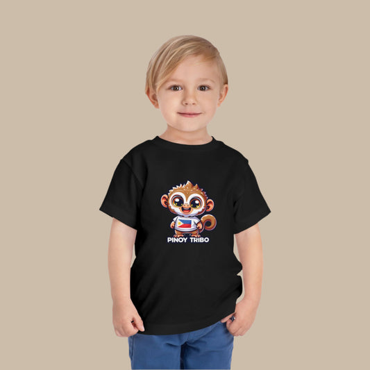 Toddler tee design featuring a cartoon tarsier character wearing a shirt with the Philippine flag and the words “Pinoy Tribo,” symbolizing Filipino pride and culture.