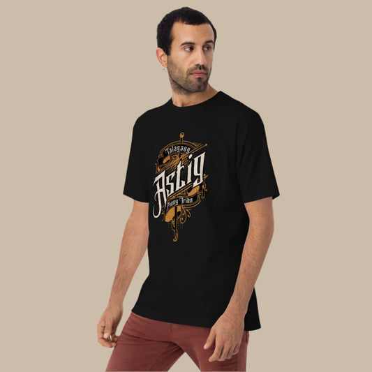 "Talagang Astig" Filipino Streetwear Graphic Tee featuring a distressed gold and white design with bold typography and intricate sword artwork, celebrating Pinoy pride.