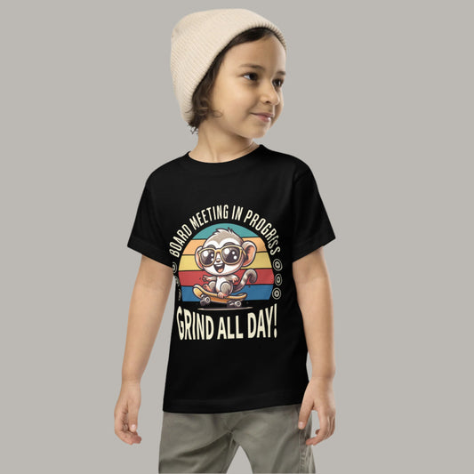 Toddler tee design featuring a cartoon tarsier wearing sunglasses on a skateboard with retro stripes and the phrases “Board Meeting in Progress” and “Grind All Day,” blending skater style with Filipino fun.