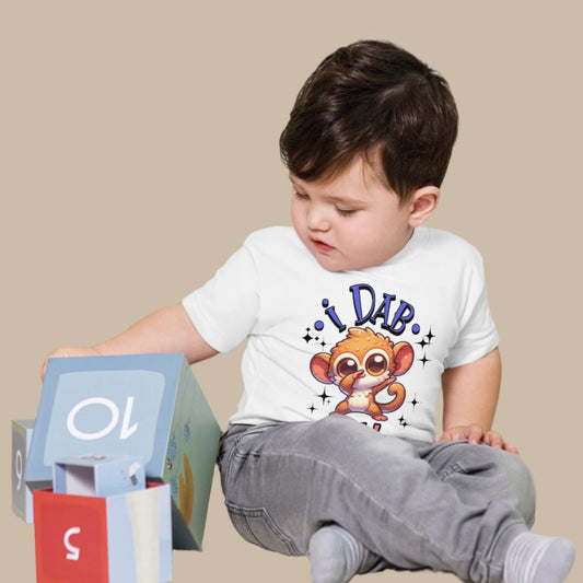 Toddler tee design featuring a cartoon tarsier dabbing with the playful text “I Dab for Yah!” surrounded by sparkles, blending humor and Filipino charm.