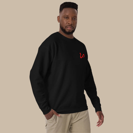 Crewneck sweatshirt with vertical "PINOY TRIBO" text and Filipino sun on sleeve, Baybayin character design on left chest