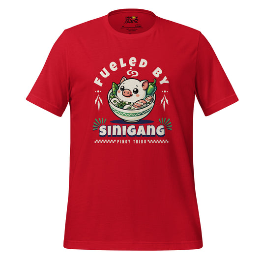 T-shirt featuring 'Fueled by Sinigang' graphic with an adorable pig in a bowl of Sinigang, part of PINOY TRIBO™'s Filipino-inspired apparel collection.