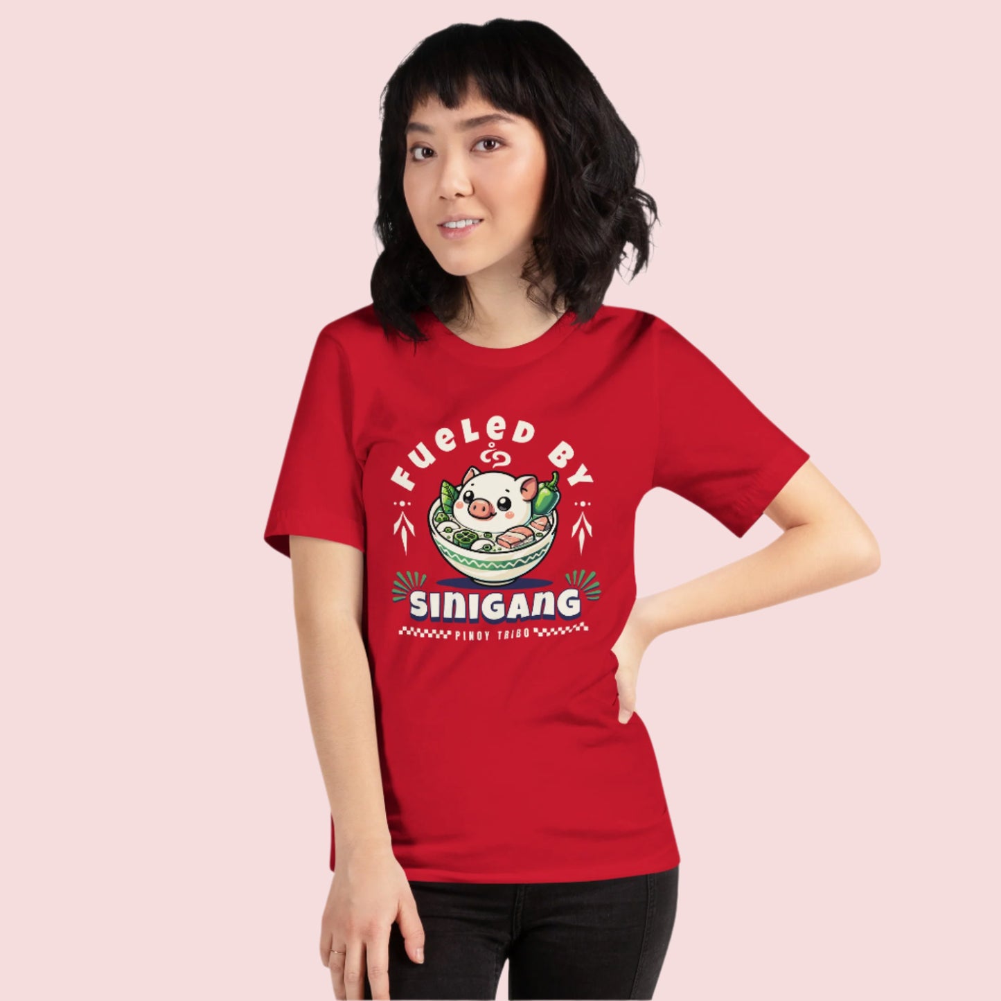 T-shirt featuring 'Fueled by Sinigang' graphic with an adorable pig in a bowl of Sinigang, part of PINOY TRIBO™'s Filipino-inspired apparel collection.