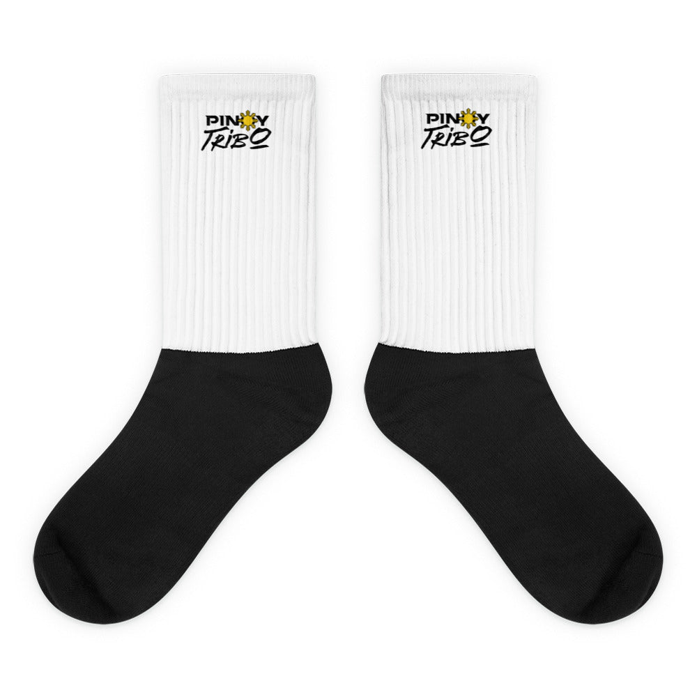 Crew-length socks with ribbed upper and cushioned sole, featuring a sublimation-printed PINOY TRIBO™ logo on the leg portion.