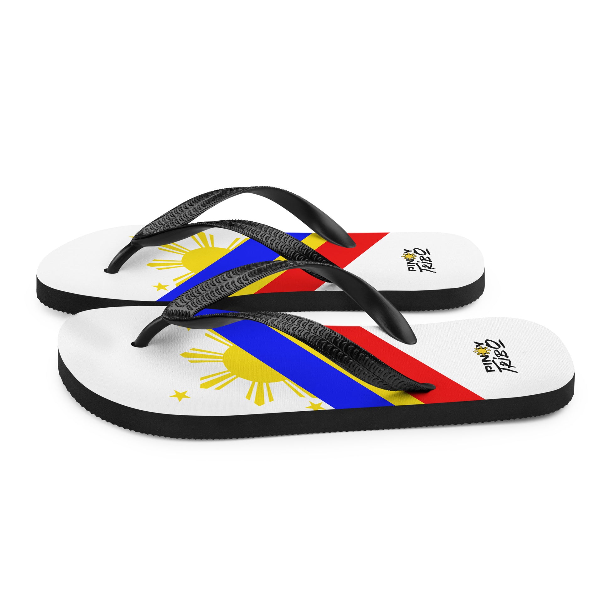 Flip flops featuring a bold Philippine flag-inspired design with diagonal blue, red, and yellow stripes, black straps, and the PINOY TRIBO™ logo printed at the heel.