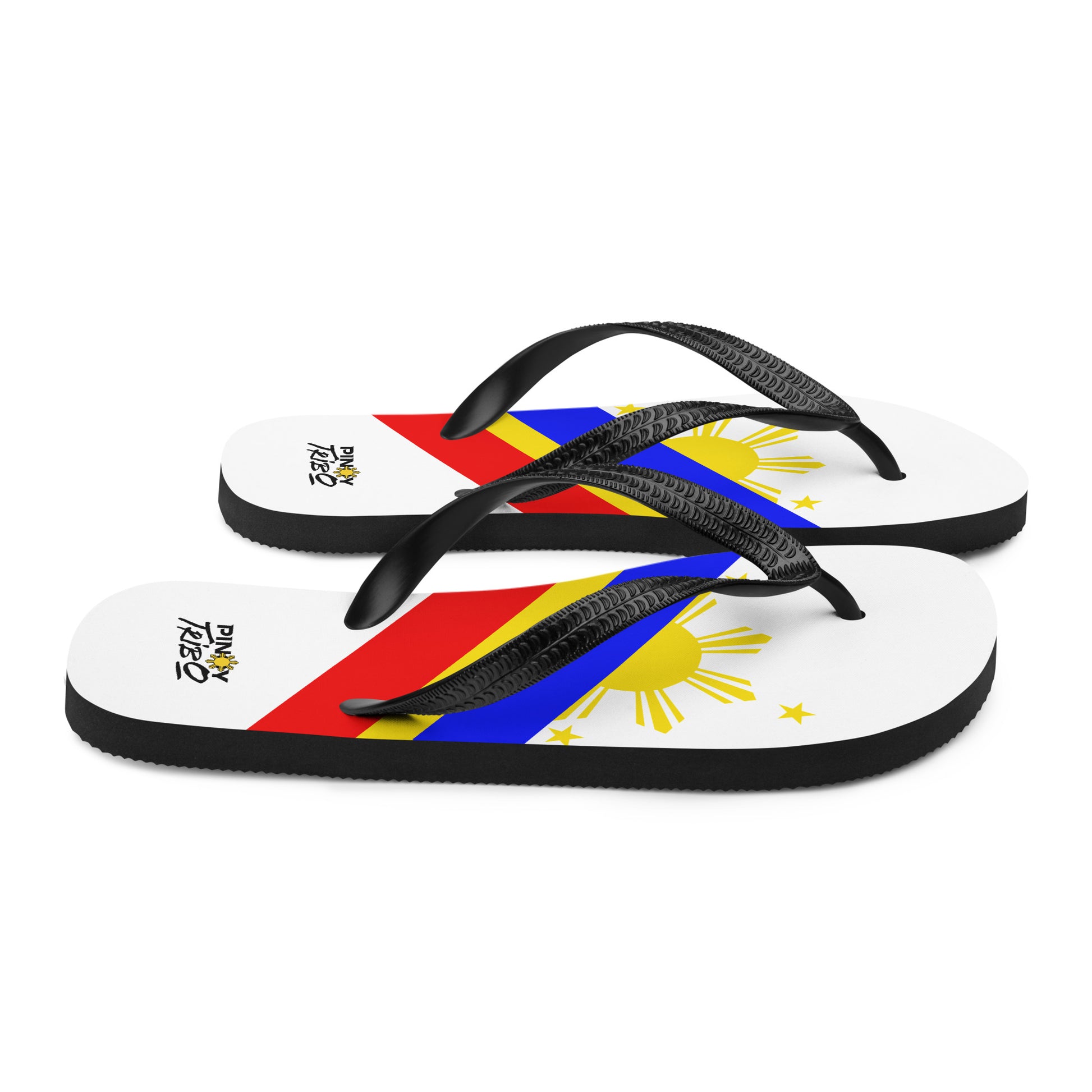 Flip flops featuring a bold Philippine flag-inspired design with diagonal blue, red, and yellow stripes, black straps, and the PINOY TRIBO™ logo printed at the heel.