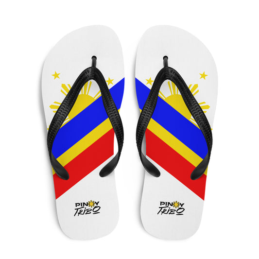 Flip flops featuring a bold Philippine flag-inspired design with diagonal blue, red, and yellow stripes, black straps, and the PINOY TRIBO™ logo printed at the heel.
