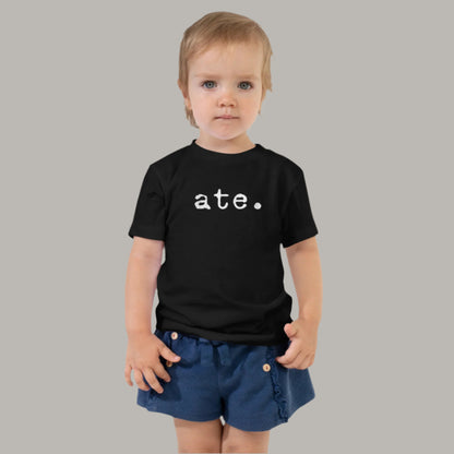 Toddler tee featuring bold text that reads “ate” in a vintage typewriter-style font, representing Filipino culture and identity.