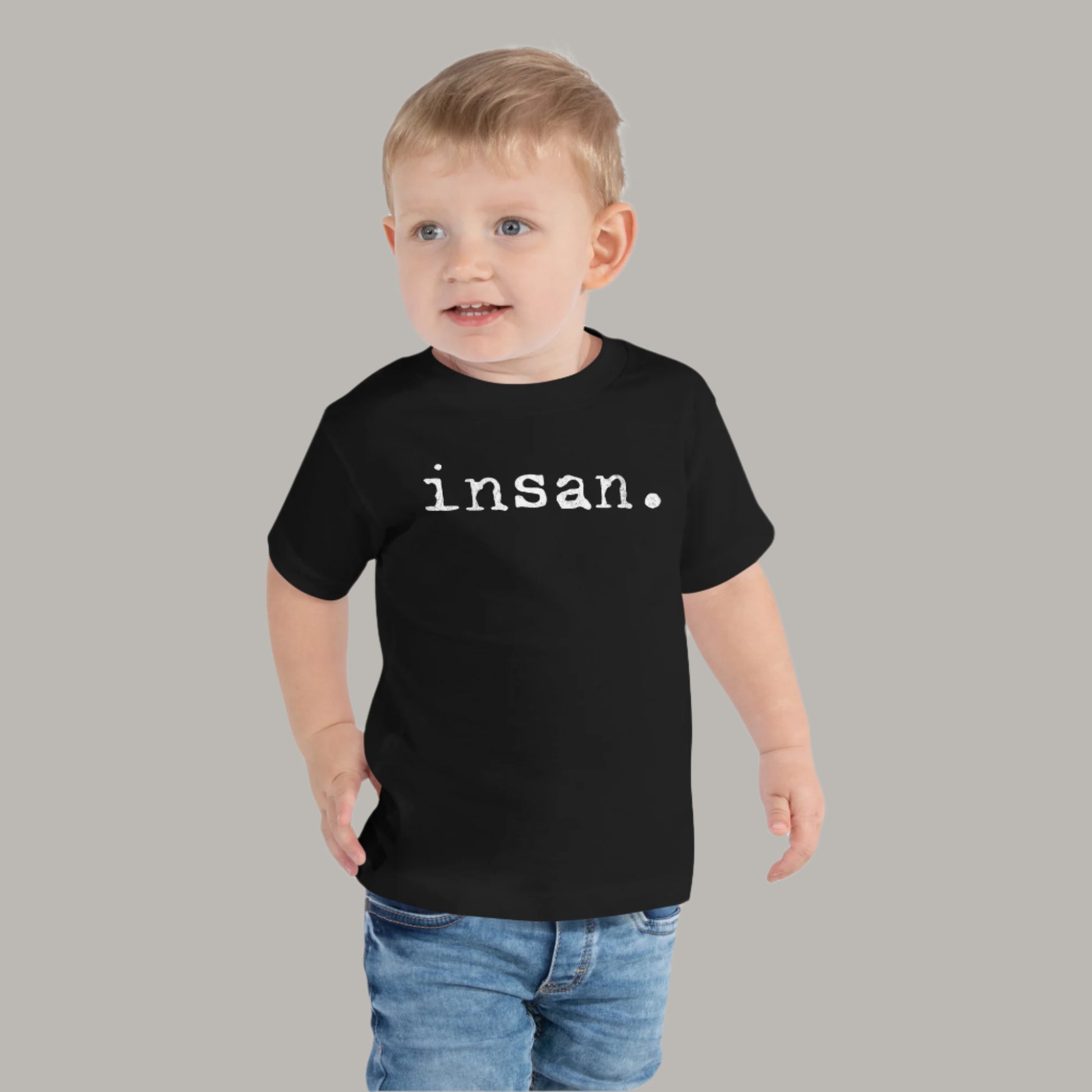 Toddler tee design with bold text reading “insan.” in a grunge typewriter-style font, representing the Filipino word for cousin.
