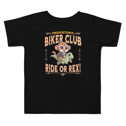 Toddler tee design featuring a cartoon tarsier in a leather jacket riding a green dinosaur with the text “Prehistoric Biker Club – Ride or Rex!” for a fun and adventurous Filipino-inspired design.