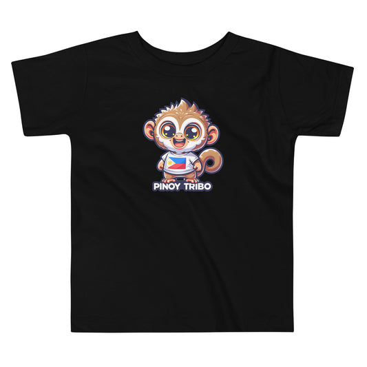 Toddler tee design featuring a cartoon tarsier character wearing a shirt with the Philippine flag and the words “Pinoy Tribo,” symbolizing Filipino pride and culture.