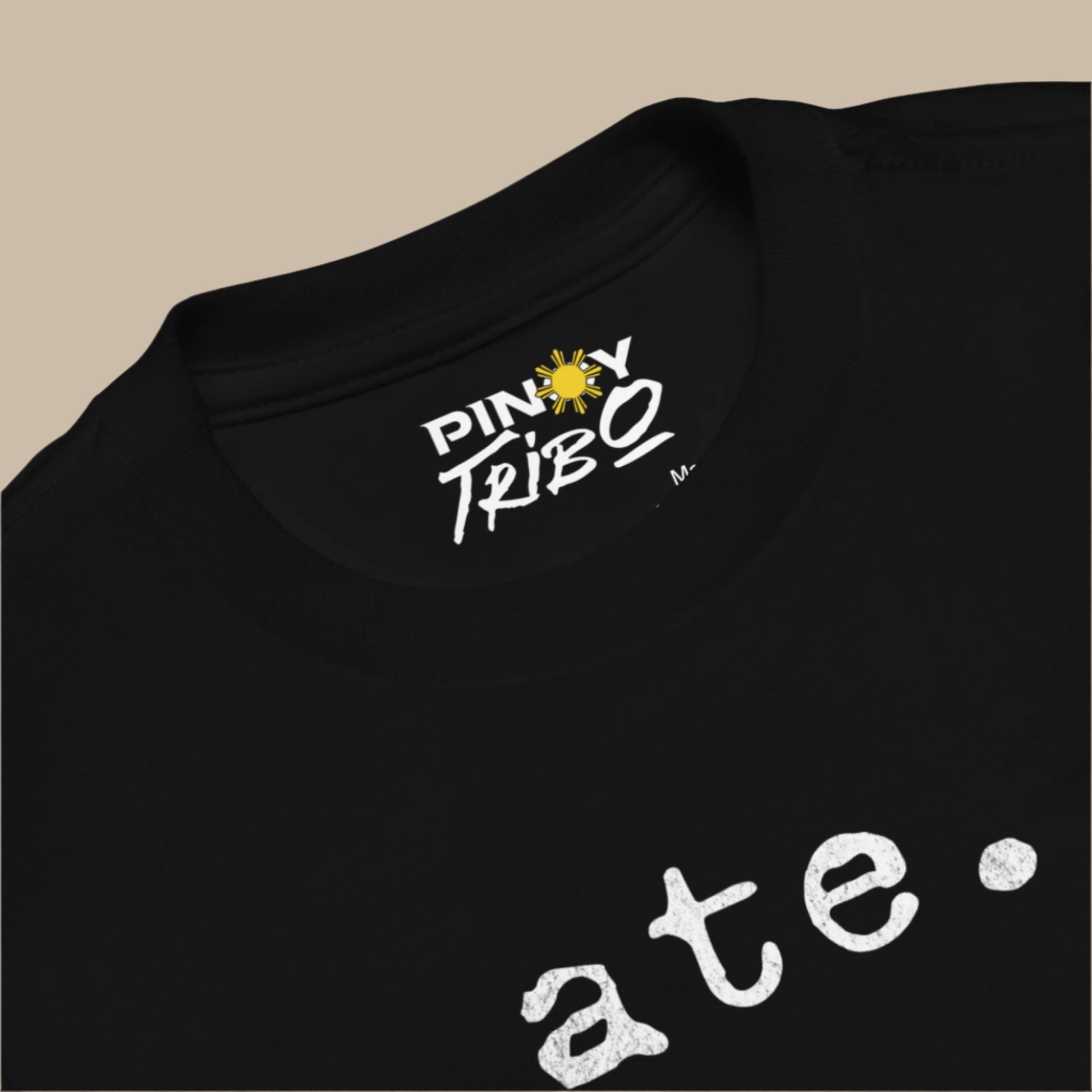Toddler tee featuring bold text that reads “ate” in a vintage typewriter-style font, representing Filipino culture and identity.