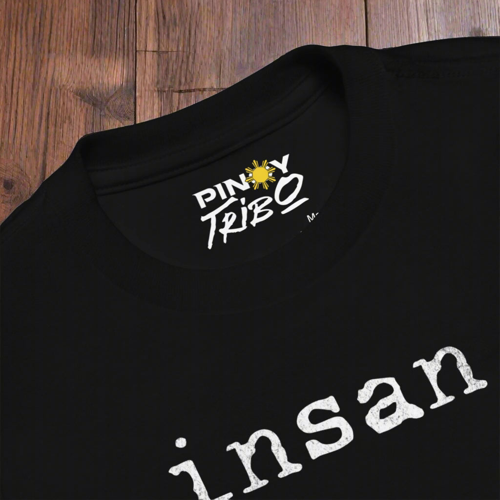 Toddler tee design with bold text reading “insan.” in a grunge typewriter-style font, representing the Filipino word for cousin.