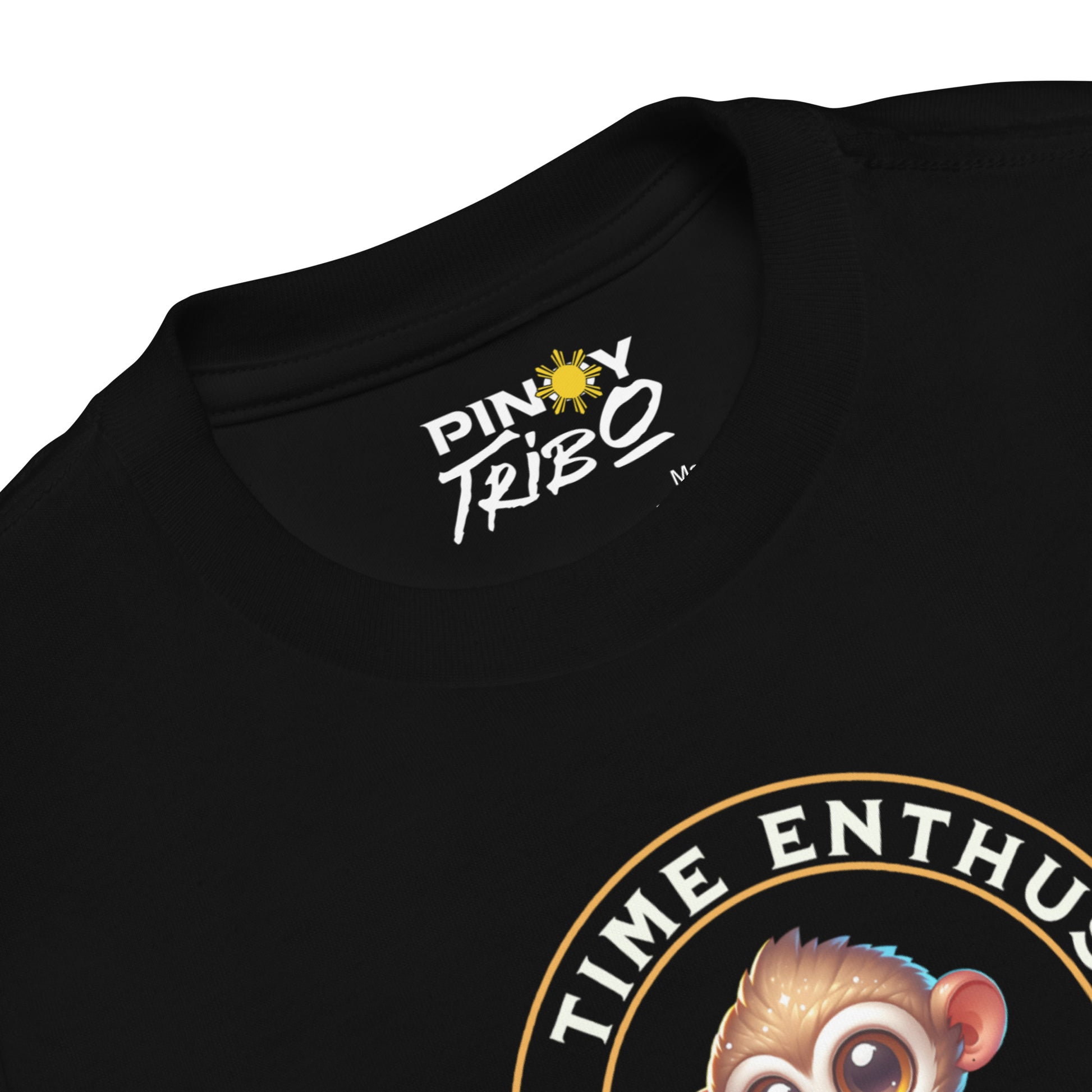 Toddler tee design featuring a cartoon tarsier named Taro eating chips from a bag with the words “Snack Time Enthusiast” in a circular badge-style layout.
