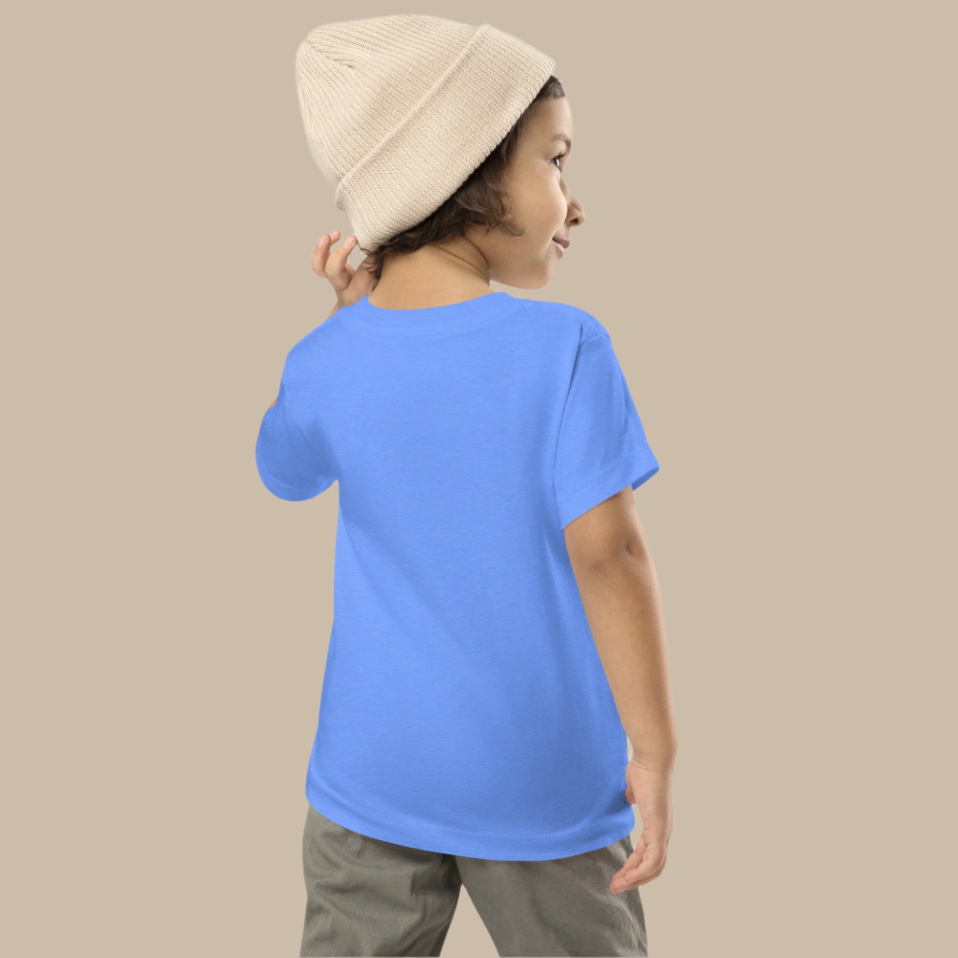 Toddler tee design with bold vertical text spelling “PINOY” in red, yellow, and blue with block-style accents, inspired by the Philippine flag.