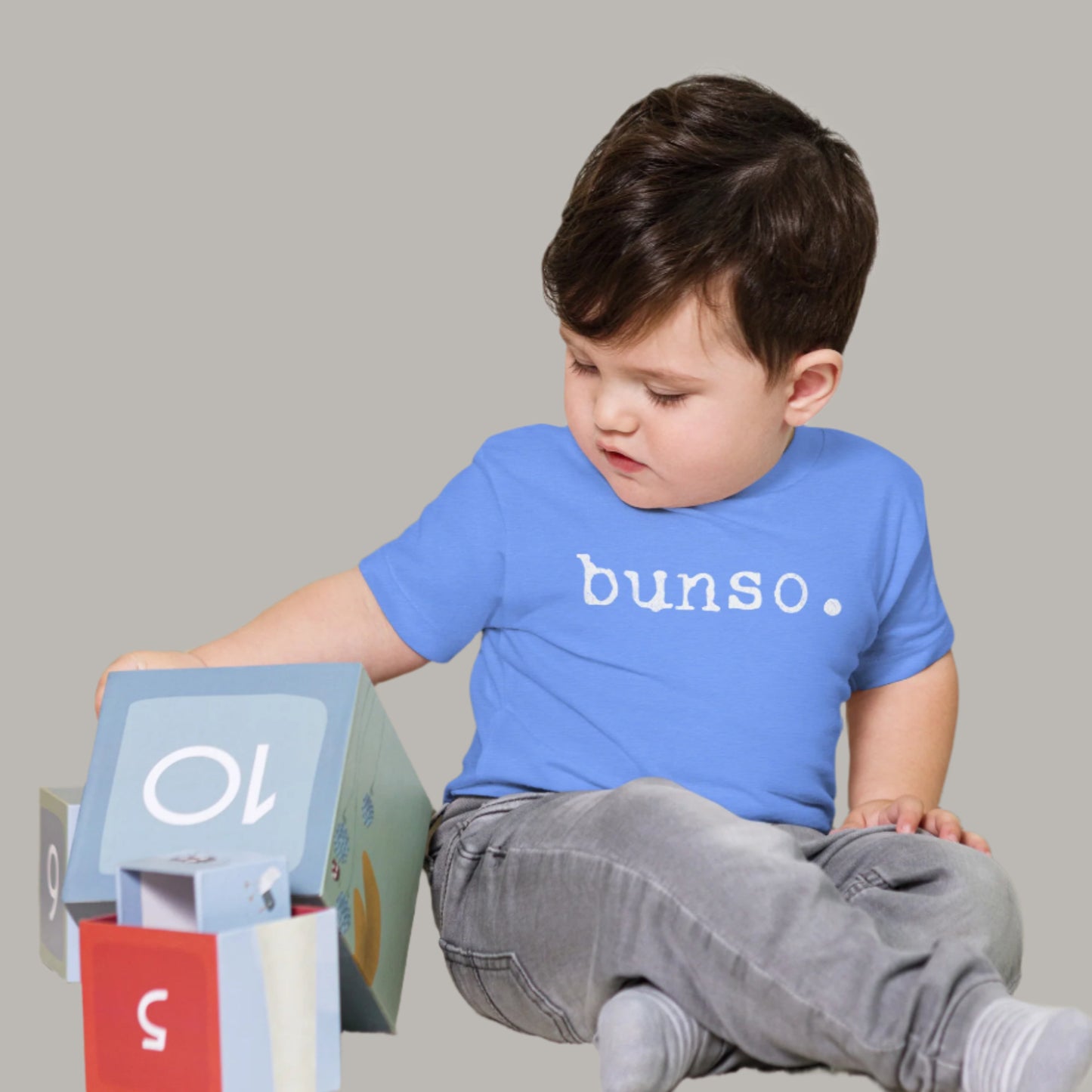 Toddler tee with white typewriter-style text that reads “bunso.” representing the Filipino term for the youngest sibling.
