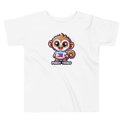 Toddler tee design featuring a cartoon tarsier character wearing a shirt with the Philippine flag and the words “Pinoy Tribo,” symbolizing Filipino pride and culture.