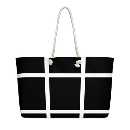 Weekender bag with a black-and-white grid design and Pinoy Tribo logo at the center, featuring rope handles.