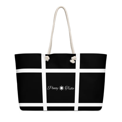 Weekender bag with a black-and-white grid design and Pinoy Tribo logo at the center, featuring rope handles.