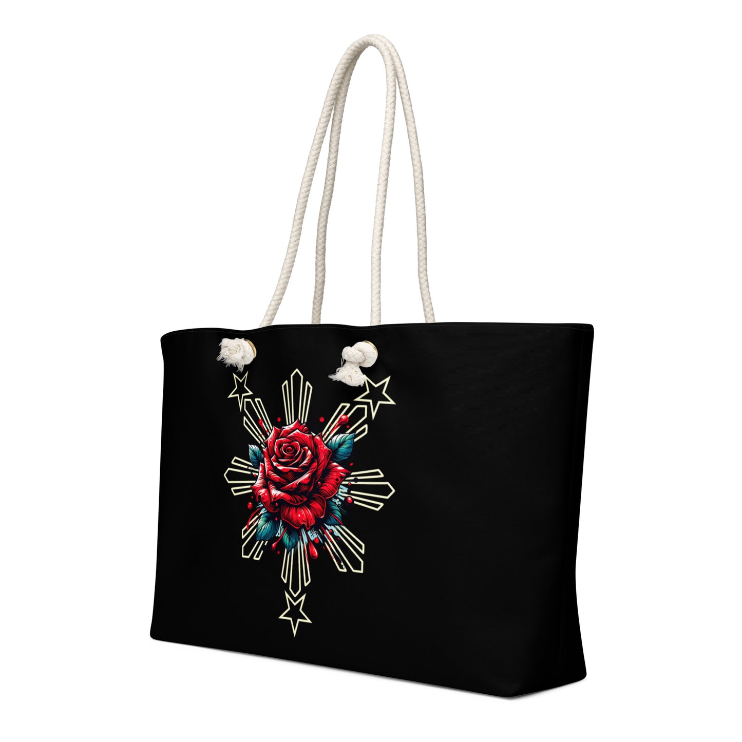 Weekender bag with a rose and sunburst three-star Filipino design on a black background with rope handles.