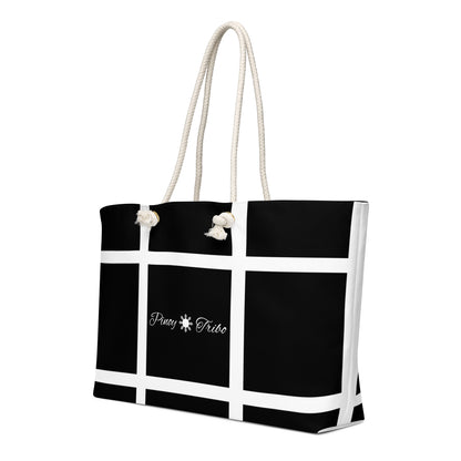 Weekender bag with a black-and-white grid design and Pinoy Tribo logo at the center, featuring rope handles.