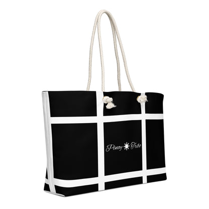 Weekender bag with a black-and-white grid design and Pinoy Tribo logo at the center, featuring rope handles.
