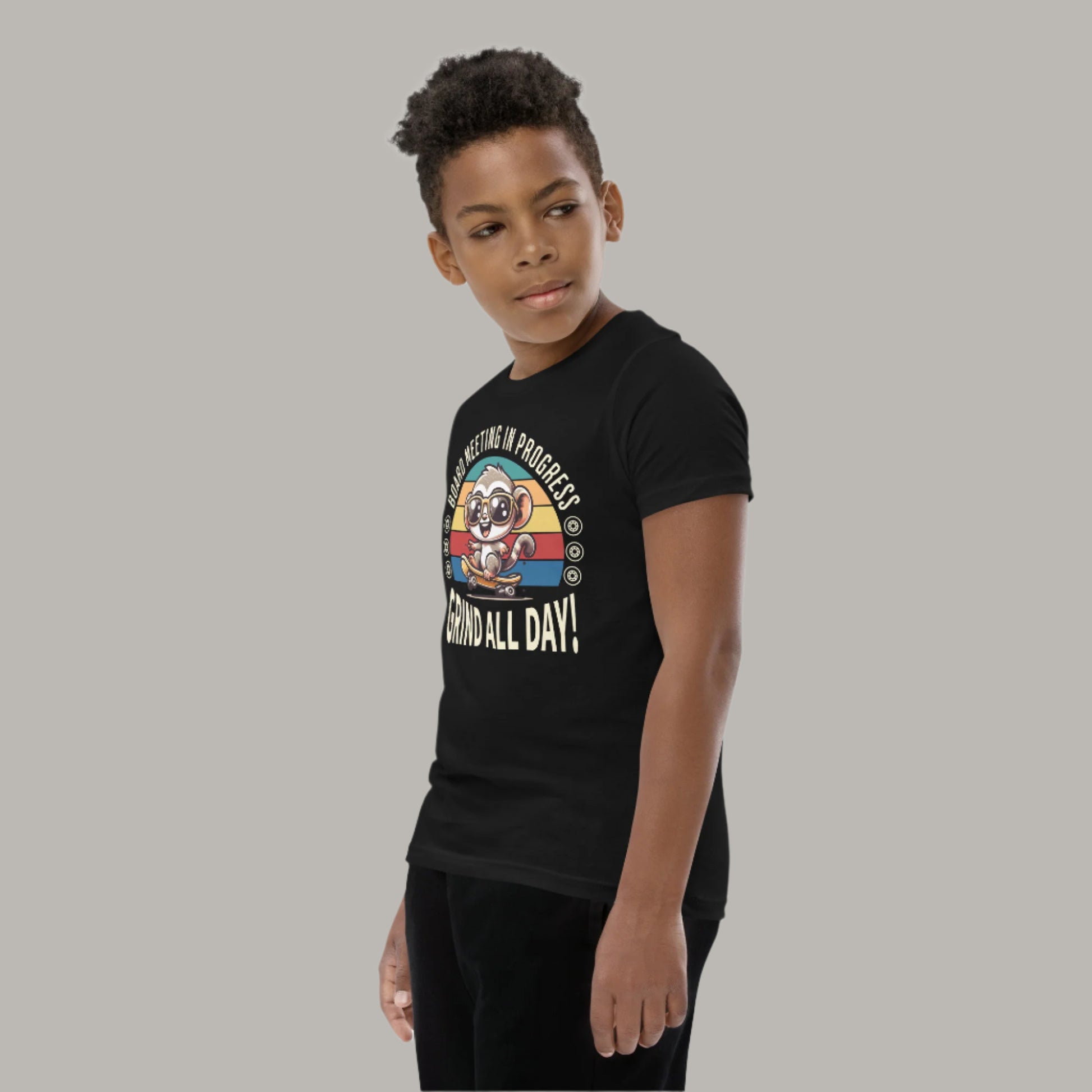 Cute cartoon Philippine tarsier wearing sunglasses, riding a skateboard with a retro striped background and the text “Board Meeting in Progress” and “Grind All Day!” on a youth t-shirt design.