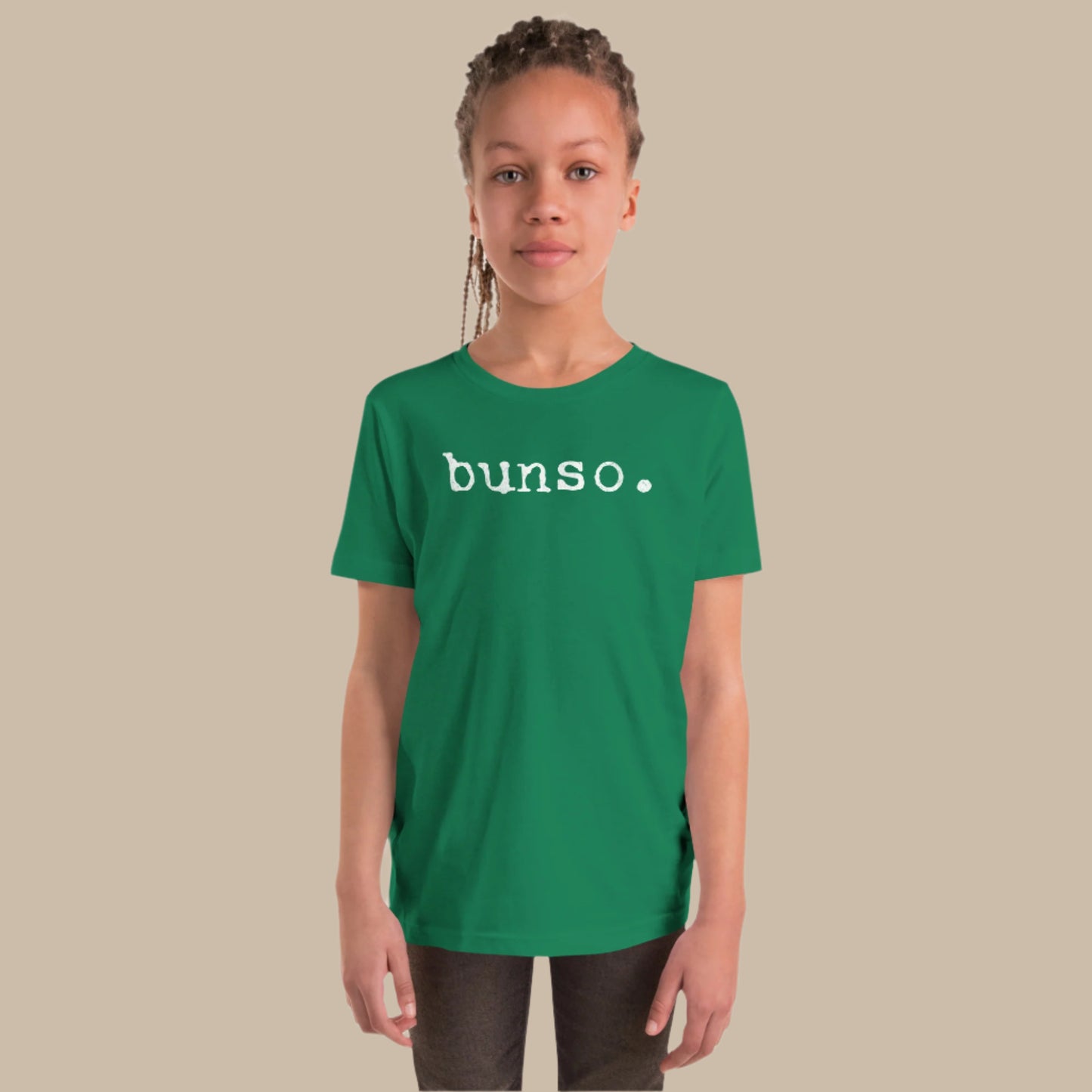 Minimalist white text “bunso.” in a typewriter-style font on a youth t-shirt design.