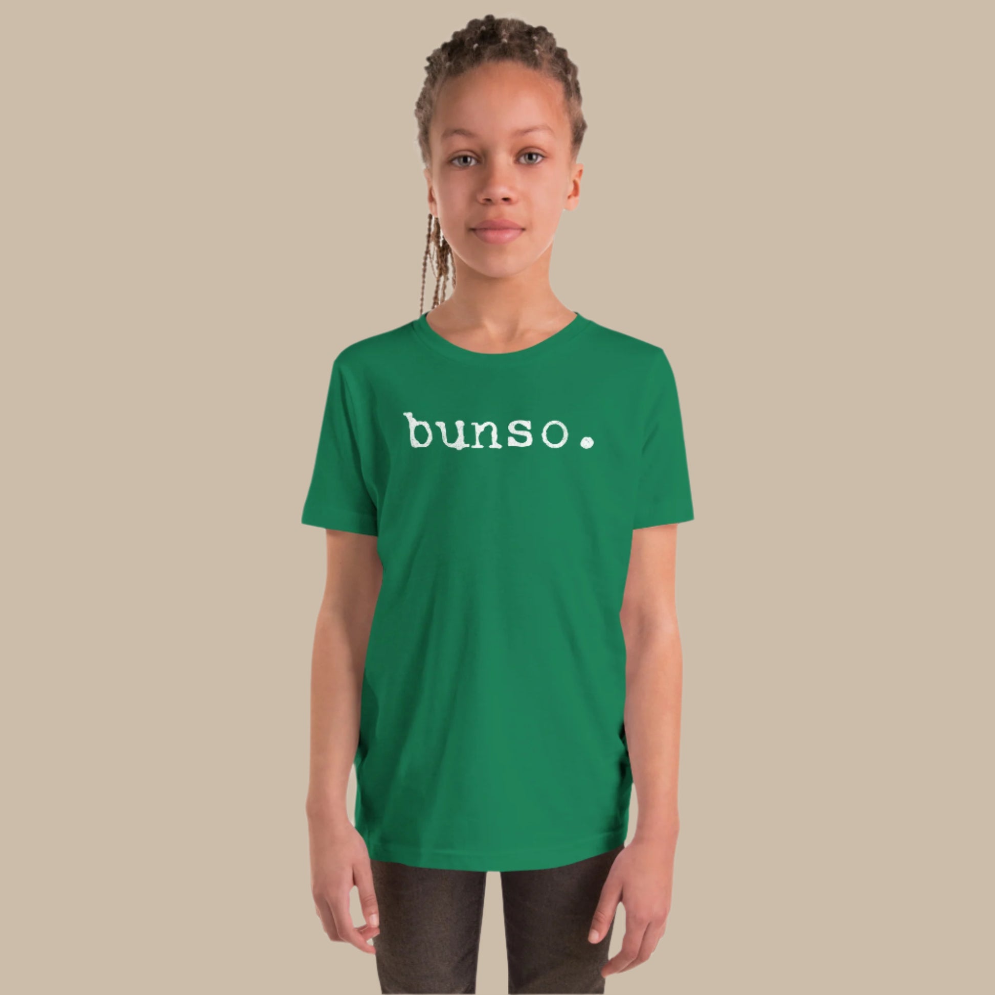 Minimalist white text “bunso.” in a typewriter-style font on a youth t-shirt design.