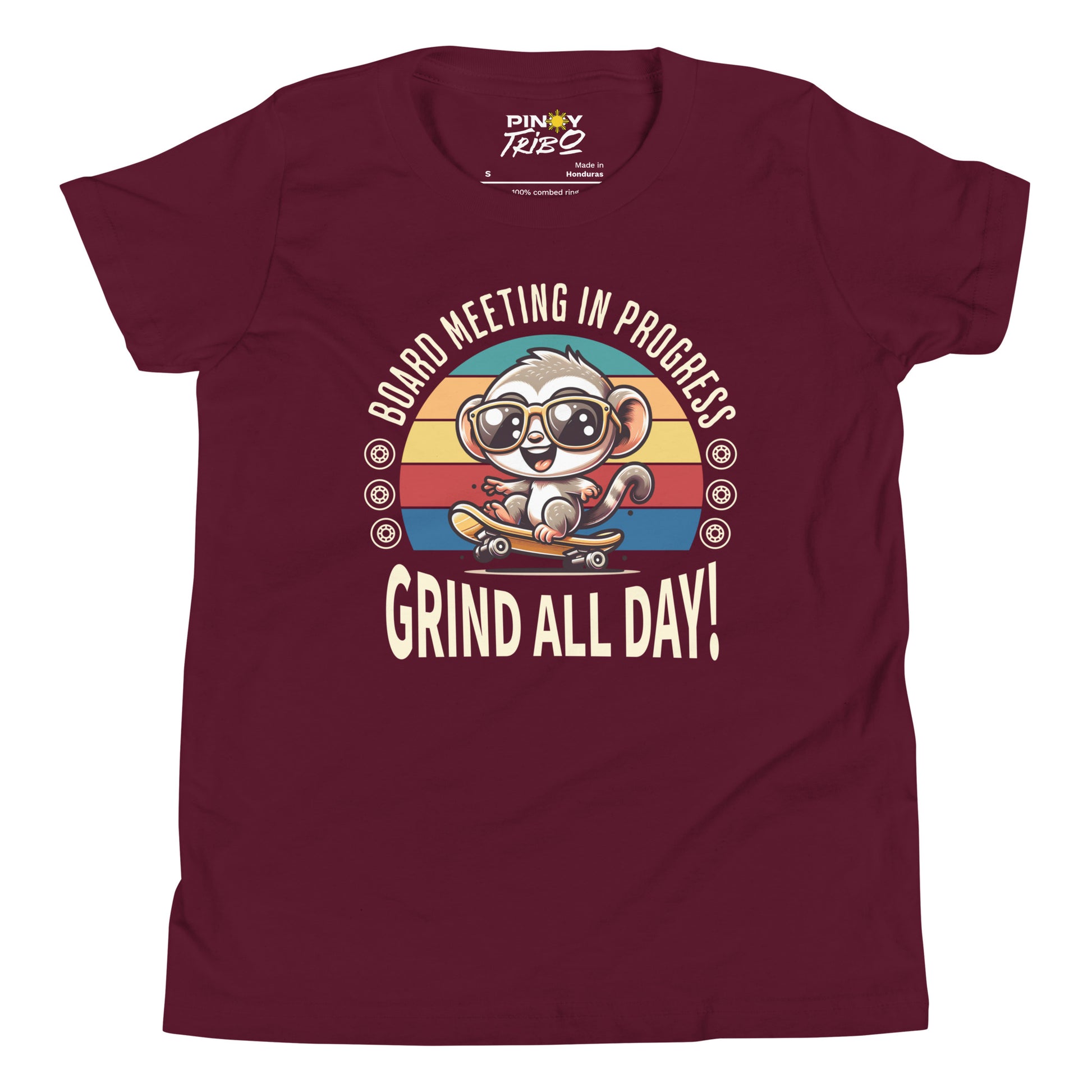 Cute cartoon Philippine tarsier wearing sunglasses, riding a skateboard with a retro striped background and the text “Board Meeting in Progress” and “Grind All Day!” on a youth t-shirt design.