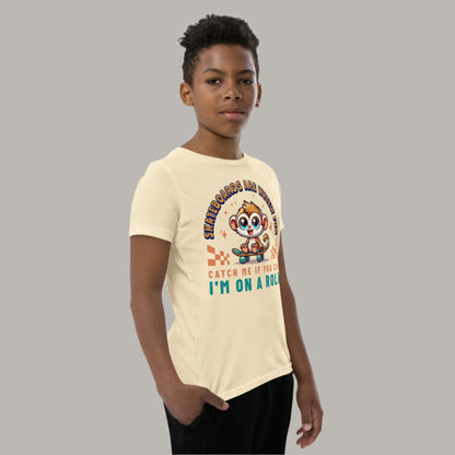 Cute cartoon Philippine tarsier riding a skateboard with playful text “Skateboards Are Wheely Fun,” “Catch Me If You Can,” and “I’m On a Roll” on a youth t-shirt design.